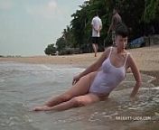 White one-piece transparent when wet swimsuit from see beach