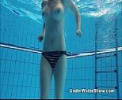 Redheaded cutie swimming nude in the pool from swim bra