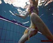Blonde in a dress in a pool from australian nudist teens
