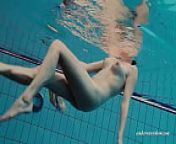 Floating babe in the swimming pool naked from wonder woman in deep water