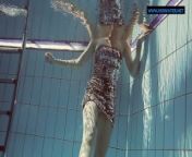 Lastova being flashy underwater from daylight pool nudist family